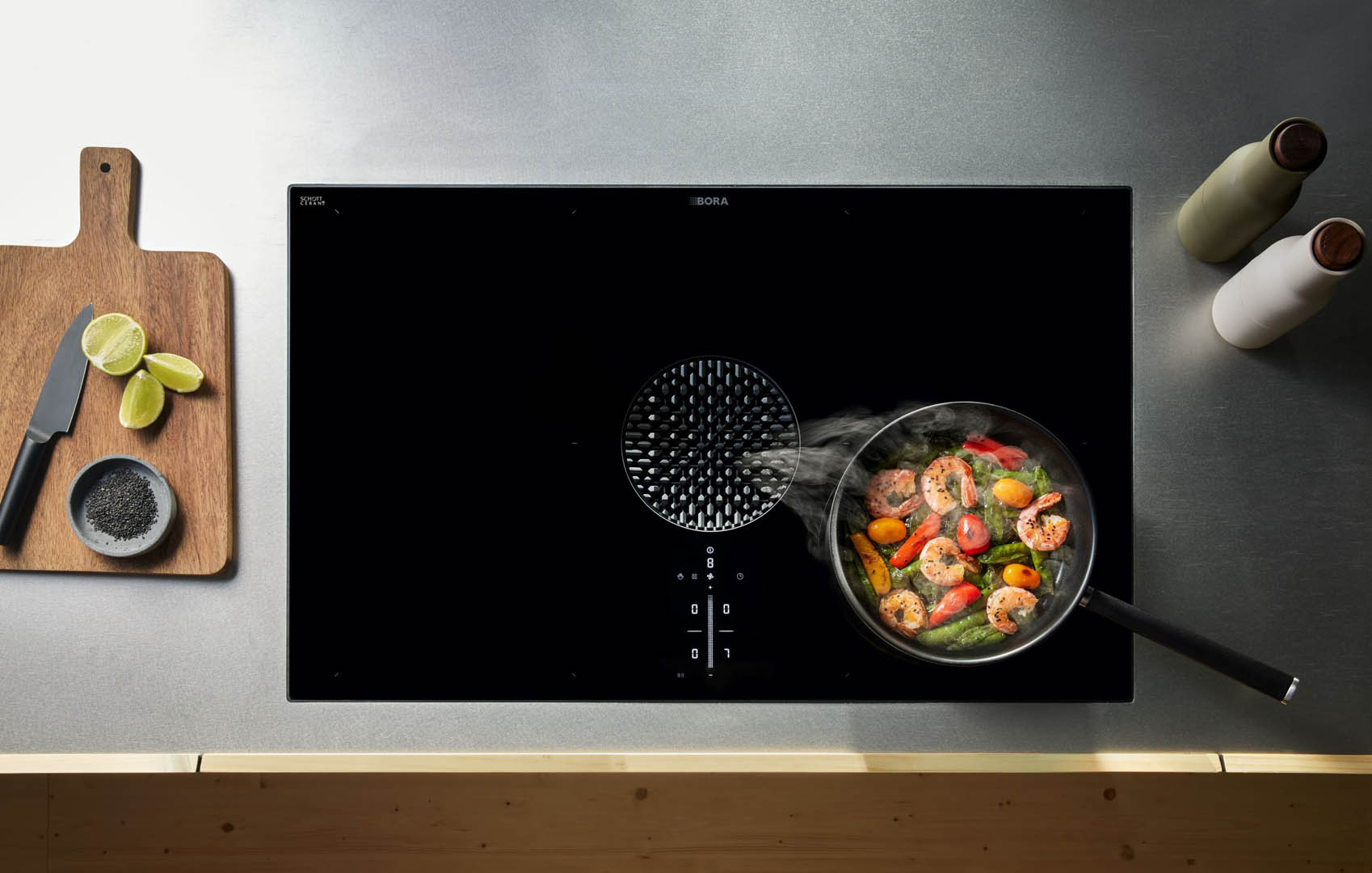 Cooktop with integrated extractor in modern kitchen